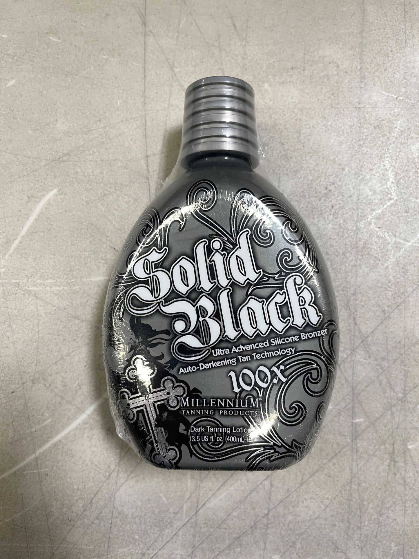 Millennium Tanning Solid Black 100X Indoor Tanning Lotion for Tanning Beds (13.5 Fluid Ounces) Beauty & Personal Care Millennium Tanning